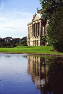 The Facade of Lyme Hall reflected in the lake