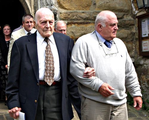 Colonel John R Ulricson leaving the Church with his son.