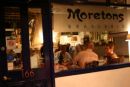 The restaurant front at night