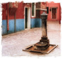 Old pump and courtyard, Burano