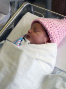 Cora is the newest inductee into the Society of the Knitted Caps (Pink Division).