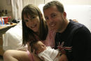 Newborn Cora with Mom and Dad.