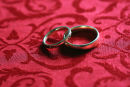 Wedding Rings on Red Damask