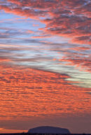 Uluru pink clouds at sunrise