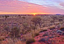 Red desert and Uluru in distance