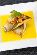 Fillet of Sea Bass with Pernod sauce and celeriac crisps.
