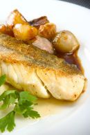 Roast haddock with caramelised shallot and garlic with champ.