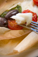 Cod with olives, cherry tomatoes ,garlic and spinach.