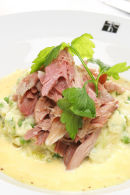 Boiled Ham Hock with grain mustard sauce and spring vegetable mash.