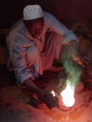 Pouring molten silver into a mould