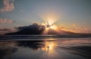 crepuscular rays over rum