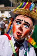 Masked Aucca Chileno dancer during the Virgen del Carmen parades, Cusco, Peru