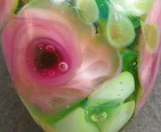 Close-up of roses with white flowers