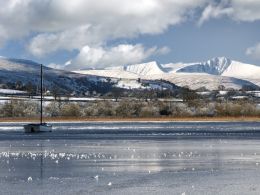 A frozen Llangorse Lake with Pen y Fan and Cribyn, Dec. 2010