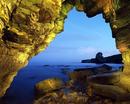 Cave inside Marsden Rock looking towards Pompeys Pillar, South Shields, UK
