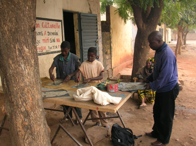 Bassidy with two young artists