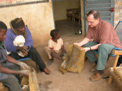 Bassidy teaching Tim how to rub the dried mud off.