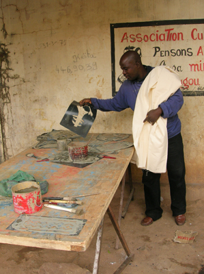 Bassidy removes a stencil