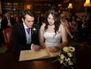Signing the register - Sam & Craig the Manor House - Aldermaston