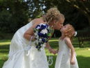 Tara kissing a young bridesmaid - from Tara & Paul's wedding at Bishopstoke.